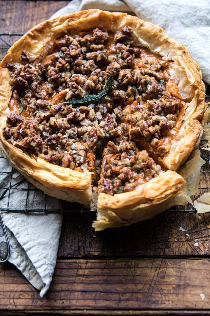 side angle photo of Bourbon Pecan Sweet Potato Phyllo Casserole with pice cut out