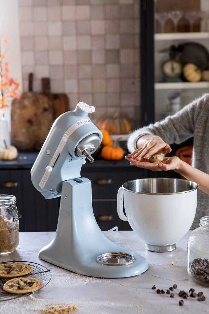 Celebrating 100 Years of KitchenAid | halfbakedharvest.com #giveaway #cookies KitchenAid on counter and cookie dough being rolled into cookies