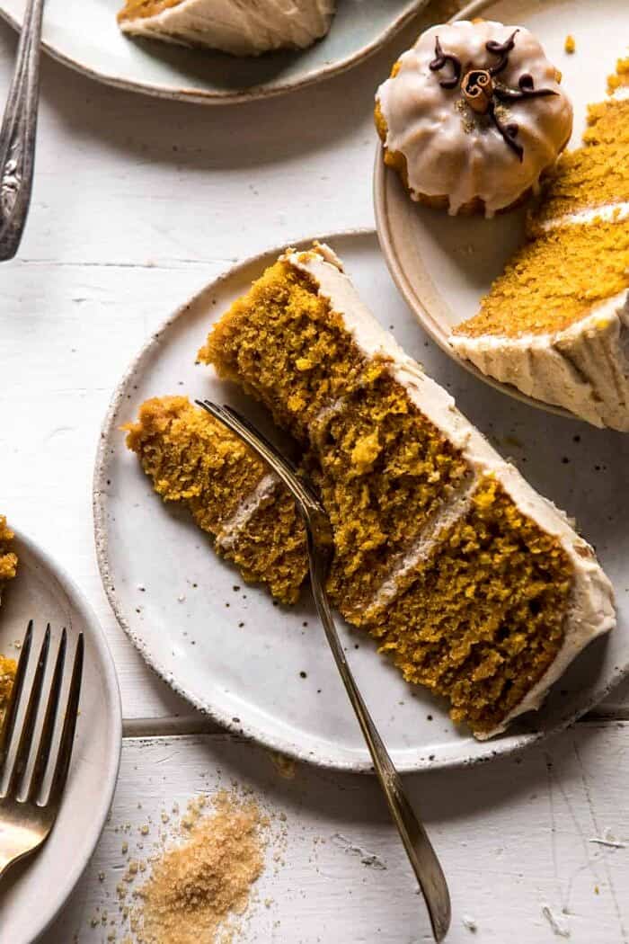 Chai Pumpkin Cake with Maple Browned Butter Frosting | halfbakedharvest.com #pumpkin #chai #fall #autumn #thanksgiving photo of Chai Pumpkin Cake slice with fork on plate
