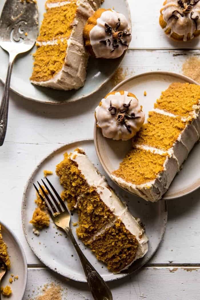 Chai Pumpkin Cake with Maple Browned Butter Frosting | halfbakedharvest.com #pumpkin #chai #fall #autumn #thanksgiving overhead photo of Chai Pumpkin slices with forks on plate