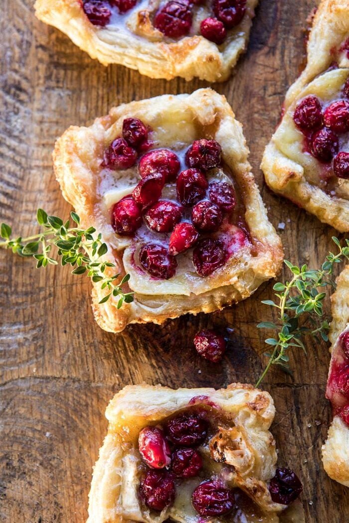 Cranberry Brie Pastry Tarts | halfbakedharvest.com #brie #cranberries #appetizers #thanksgiving #christmas overhead close up photo of Cranberry Brie Pastry Tarts
