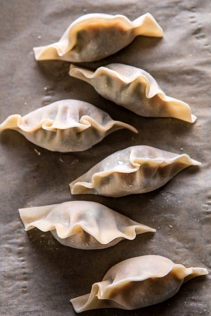 Ginger Sesame Chicken Potstickers with Sweet Chili Pomegranate Sauce | halfbakedharvest.com #asianrecipes #potstickers #dumplings #healthy Ginger Sesame Chicken Potstickers before cooking