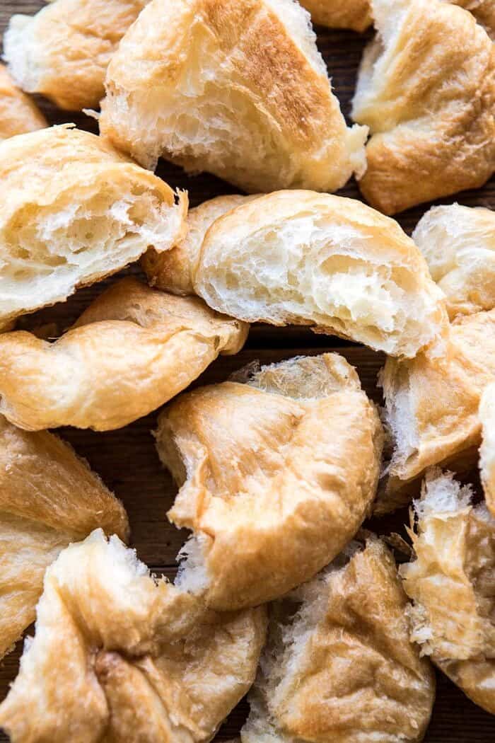 Herby Mushroom Croissant Stuffing | halfbakedharvest.com #stuffing #thanksgiving #easyrecipes #croissants overhead photo of croissants