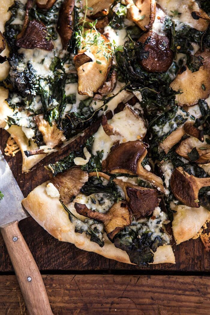 Roasted Mushroom Kale Pizza | halfbakedharvest.com #pizza #mushrooms #winter #fall #autumn #kale #Italian close up overhead photo of Roasted Mushroom Kale Pizza