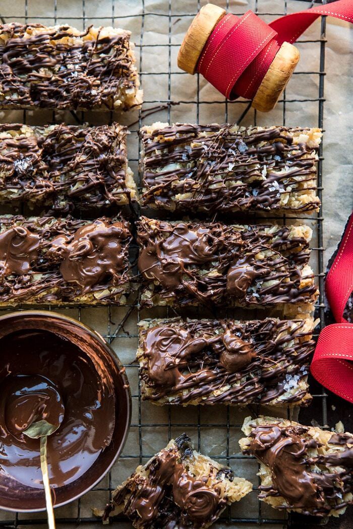 overhead photo of Salted Chocolate Coconut Bars with bowl of chocolate and ribbon 