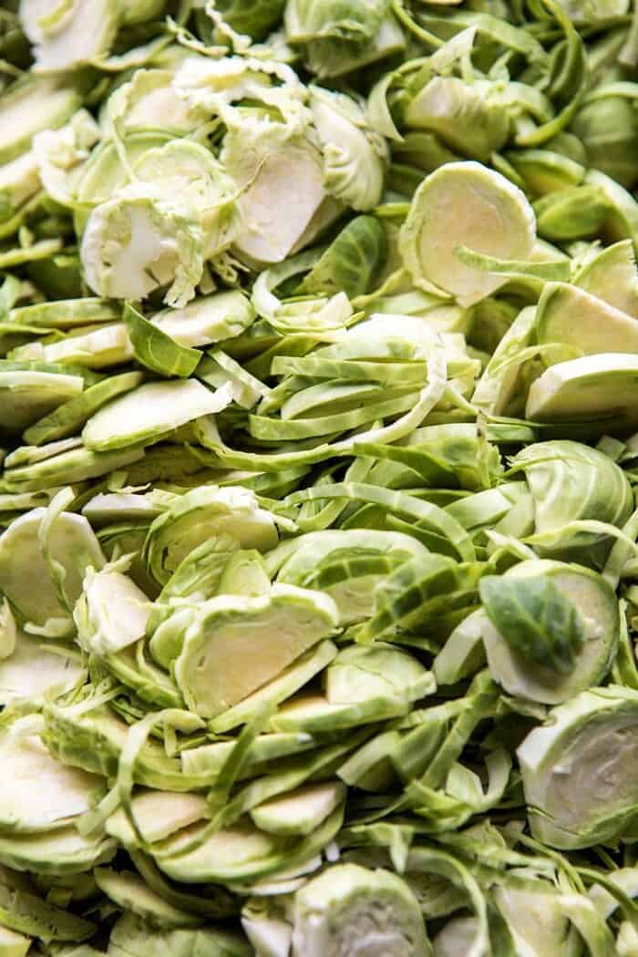 Shredded Brussels Sprout Bacon Salad with Warm Cider Vinaigrette | halfbakedharvest.com #brusselssprouts #salad #thanksgiving #fall #winter #healthy raw brussels sprouts