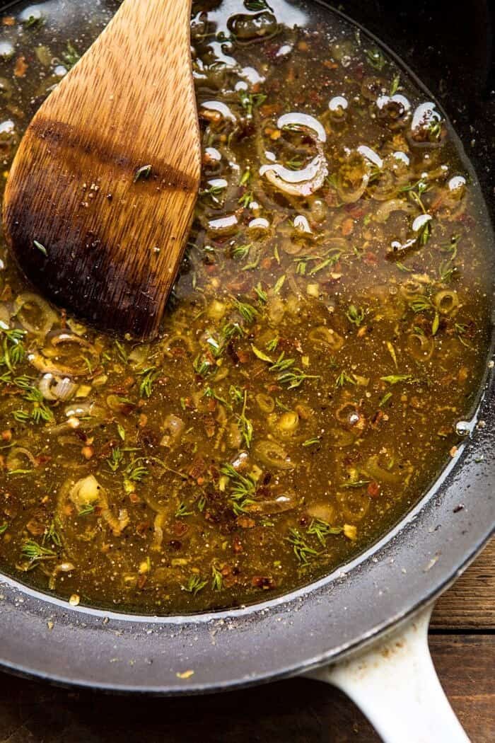 Shredded Brussels Sprout Bacon Salad with Warm Cider Vinaigrette | halfbakedharvest.com #brusselssprouts #salad #thanksgiving #fall #winter #healthy overhead photo of Warm Cider Vinaigrette