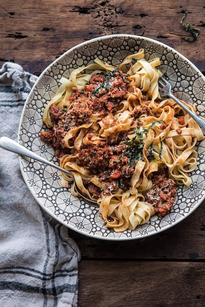 Slow Cooker Vodka Bolognese Pasta | halfbakedharvest.com #pasta #italian #bolognese #slowcooker overhead photo of Slow Cooker Vodka Bolognese Pasta tossed together in serving bowl