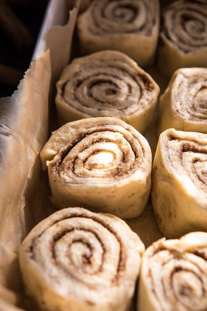 side angle photo of Easiest Overnight Eggnog Brioche Cinnamon Rolls before baking
