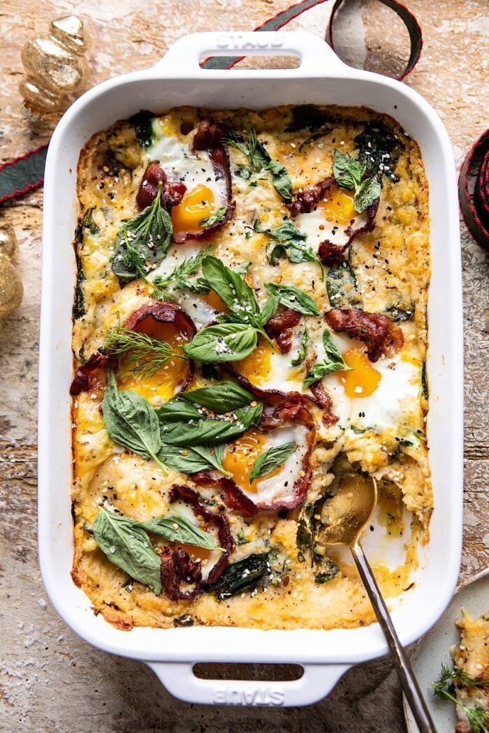 Everything Cheesy Potato and Egg Breakfast Casserole | halfbakedharvest.com #breakfast #brunch #eggs #bacon #easyrecipes overhead photo of Everything Cheesy Potato and Egg Breakfast Casserole with spoon in dish