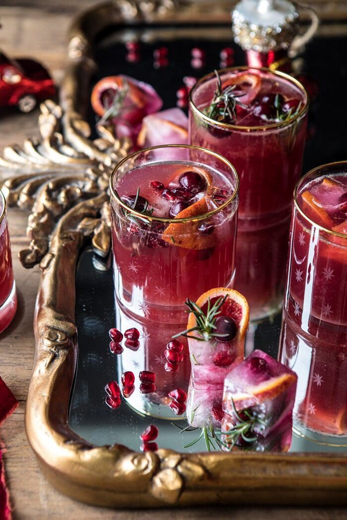 Holiday Cheermeister Bourbon Punch | halfbakedharvest.com #bourbon #holiday #christmas #cocktails #pomegranate three quarter angle photo of Holiday Cheermeister Bourbon Punch