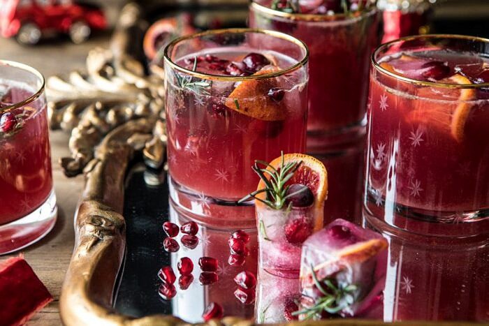 Holiday Cheermeister Bourbon Punch | halfbakedharvest.com #bourbon #holiday #christmas #cocktails #pomegranate horizontal photo of Holiday Cheermeister Bourbon Punch