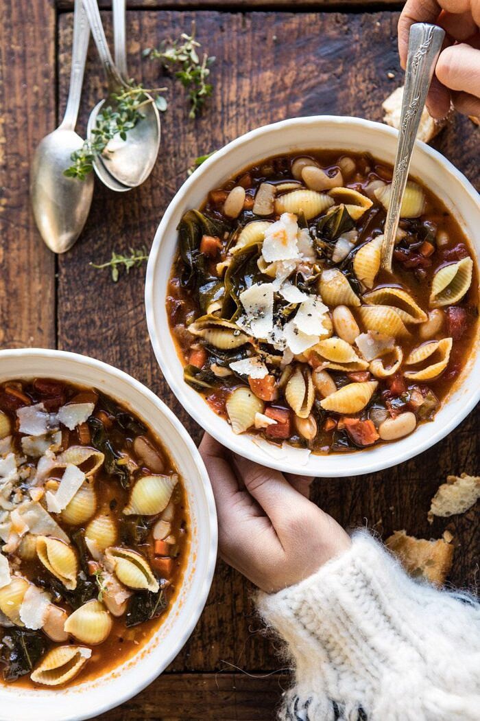 Instant Pot Pasta e Fagioli | halfbakedharvest.com #instantpot #soup #healthyrecipes overhead photo of Instant Pot Pasta e Fagioli with hands on bowl