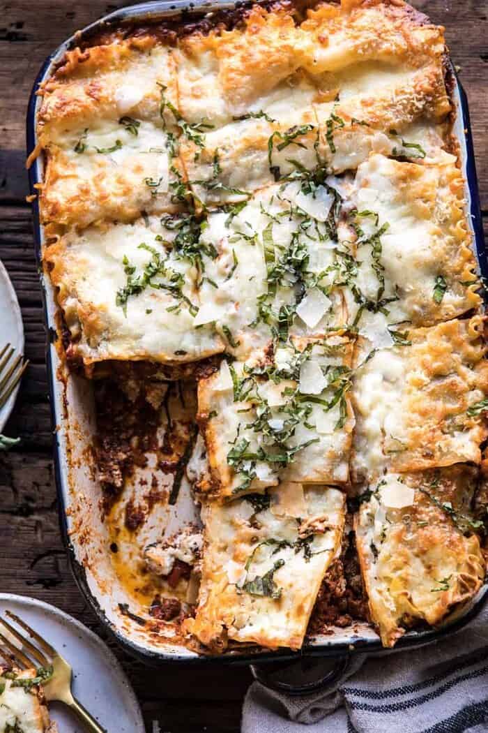 Pesto Bolognese Lasagna | halfbakedharvest.com #pasta #Italian #lasagna #cheese #holidayrecipes overhead photo of Pesto Bolognese Lasagna with slices cut