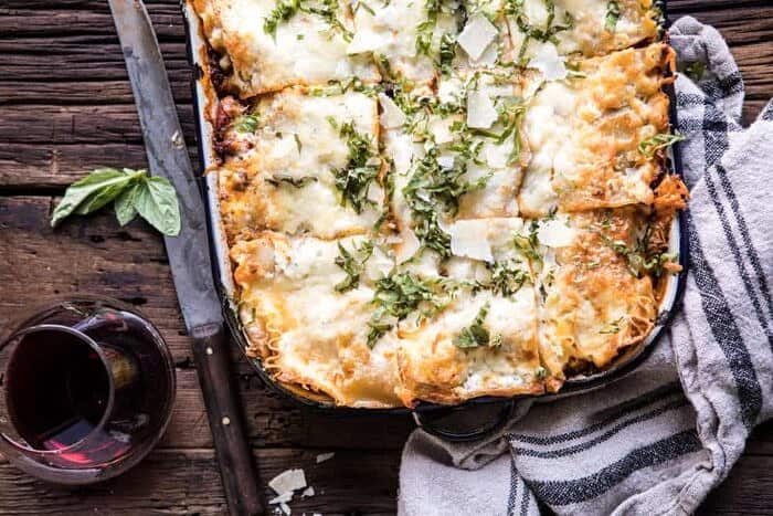 Pesto Bolognese Lasagna | halfbakedharvest.com #pasta #Italian #lasagna #cheese #holidayrecipes horizontal photo of Pesto Bolognese Lasagna