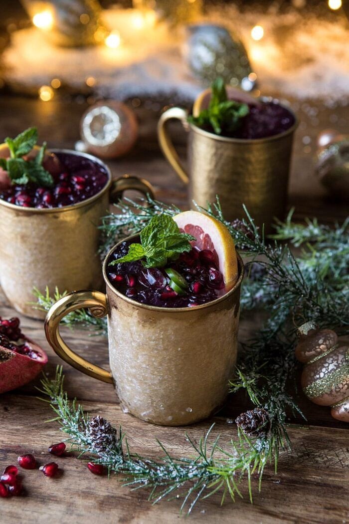 Spicy Pomegranate Moscow Mule | halfbakedharvest.com #cocktails #christmas #holiday #drinks #pomegranate #vodka close up photo of Spicy Pomegranate Moscow Mule