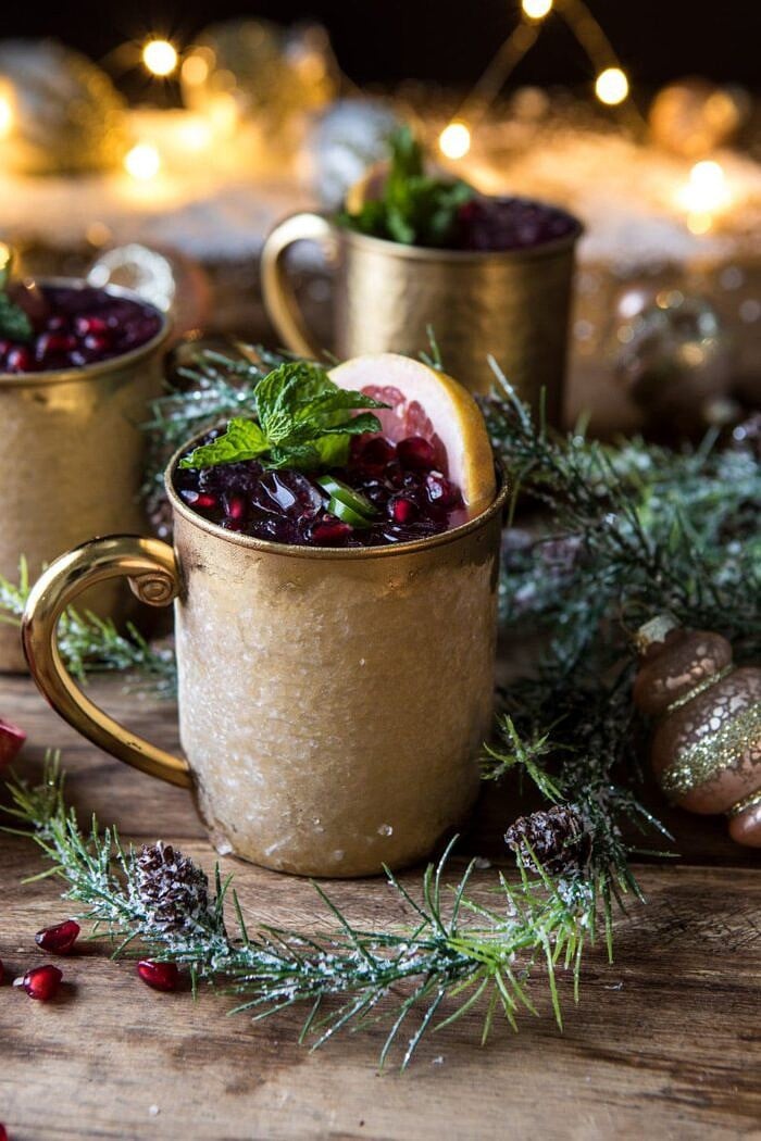 Spicy Pomegranate Moscow Mule | halfbakedharvest.com #cocktails #christmas #holiday #drinks #pomegranate #vodka side angle close up photo of Spicy Pomegranate Moscow Mule