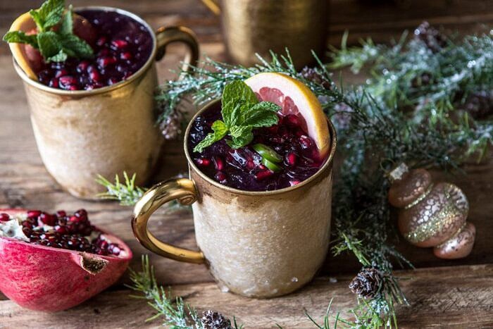 Spicy Pomegranate Moscow Mule | halfbakedharvest.com #cocktails #christmas #holiday #drinks #pomegranate #vodka horizontal photo of Spicy Pomegranate Moscow Mule