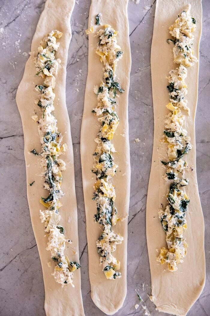 Spinach and Artichoke Stuffed Soft Pretzels | halfbakedharvest.com #softpretzels #appetizer #easyrecipes #pretzels #snacks Spinach and Artichoke Stuffed Soft Pretzel dough before rolling into pretzels