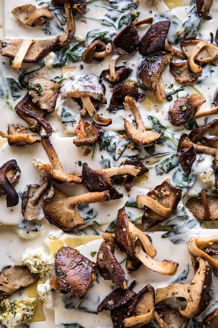 White Pesto Spinach Lasagna | halfbakedharvest.com #lasagna #pesto #italian #dinner #christmasrecipes overhead photo of White Pesto Spinach Lasagna before baking