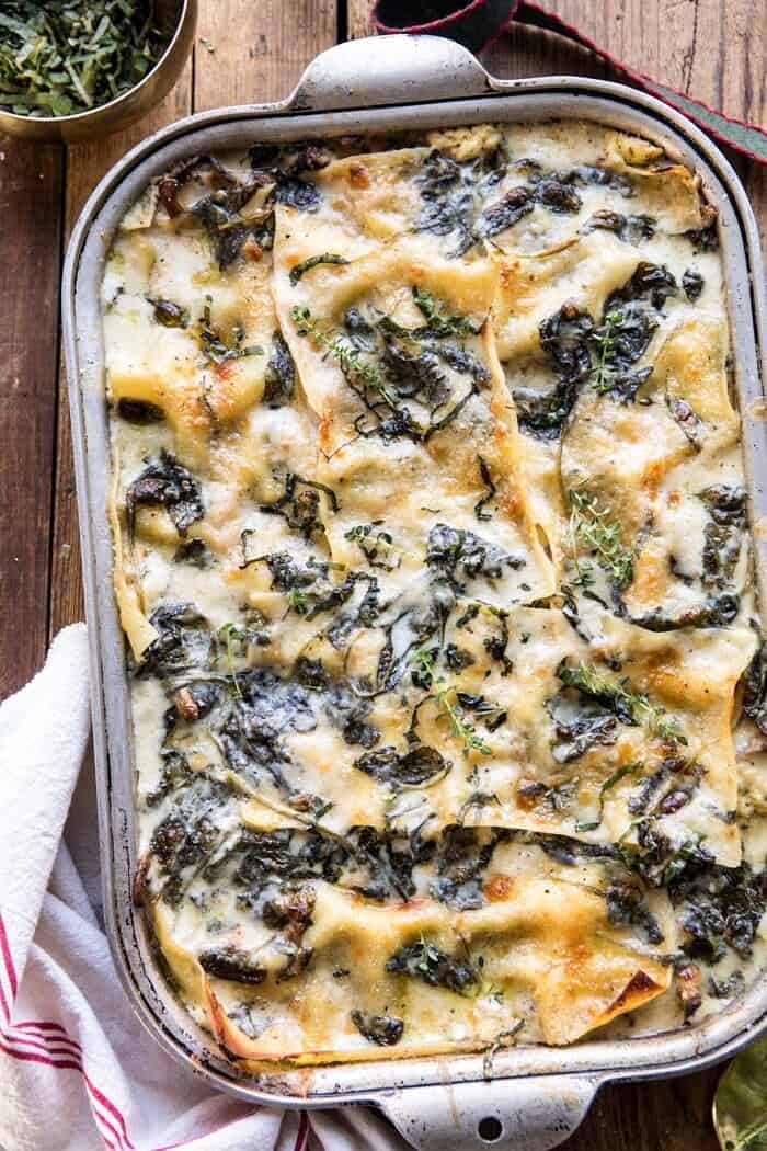 White Pesto Spinach Lasagna | halfbakedharvest.com #lasagna #pesto #italian #dinner #christmasrecipes overhead close up photo of White Pesto Spinach Lasagna