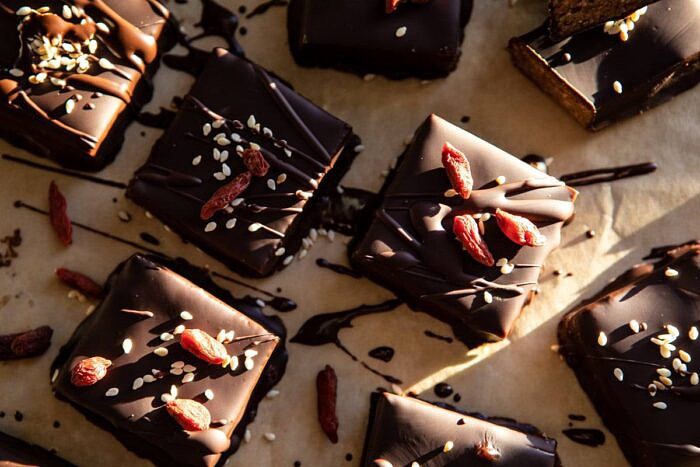 5 Ingredient Chocolate Covered Cashew Bars | halfbkaedharvest.com #chocolate #vegan #easyrecipes #dessert #healthy horizontal photo of 5 Ingredient Chocolate Covered Cashew Bars