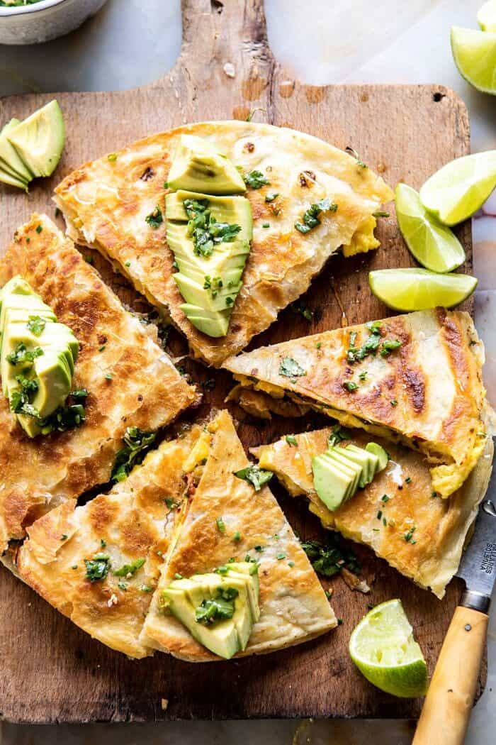 Breakfast Quesadilla with Soft Scrambled Eggs and Avocado Salsa | halfbakedharvest.com #breakfast #mexican #easyrecipes #brunch #eggs #avocado overhead close up photo of Breakfast Quesadilla with Soft Scrambled Eggs and Avocado Salsa