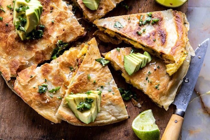 Breakfast Quesadilla with Soft Scrambled Eggs and Avocado Salsa | halfbakedharvest.com #breakfast #mexican #easyrecipes #brunch #eggs #avocado horizontal photo of Breakfast Quesadilla with Soft Scrambled Eggs and Avocado Salsa