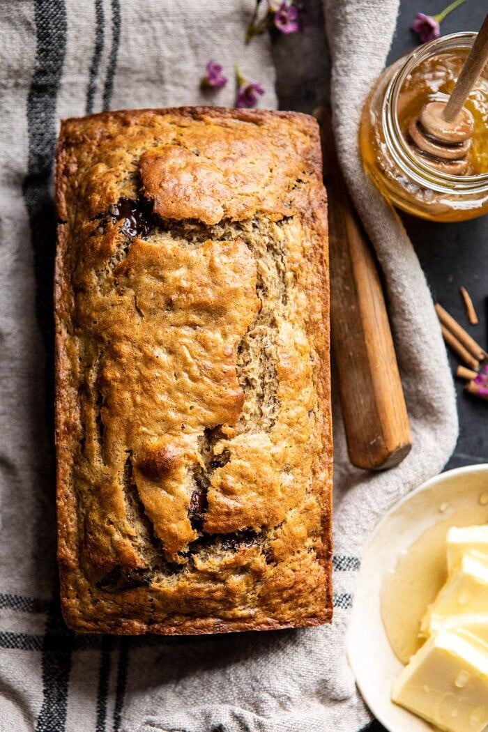 Chocolate Chunk Coconut Banana Bread | halfbakedharvest.com #bananabread #easyrecipes #healthyrecipes #chocolate #dessert overhead close up photo of Chocolate Chunk Coconut Banana Bread