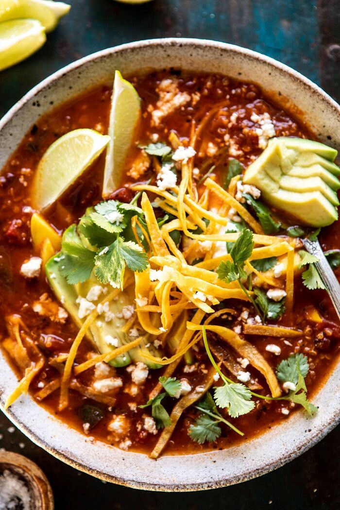 Crockpot Spicy Vegetarian Tortilla Soup with Quinoa | halfbakedharvest.com #crockpot #slowcooker #easyrecipes #healthyrecipes #healthyjanuary #mexican #soup overhead close up photo of Crockpot Spicy Vegetarian Tortilla Soup with Quinoa