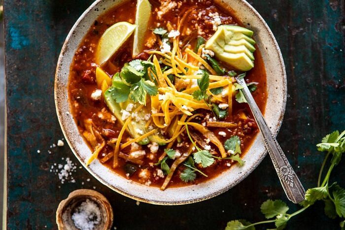 Crockpot Spicy Vegetarian Tortilla Soup with Quinoa | halfbakedharvest.com #crockpot #slowcooker #easyrecipes #healthyrecipes #healthyjanuary #mexican #soup horizontal photo of Crockpot Spicy Vegetarian Tortilla Soup with Quinoa