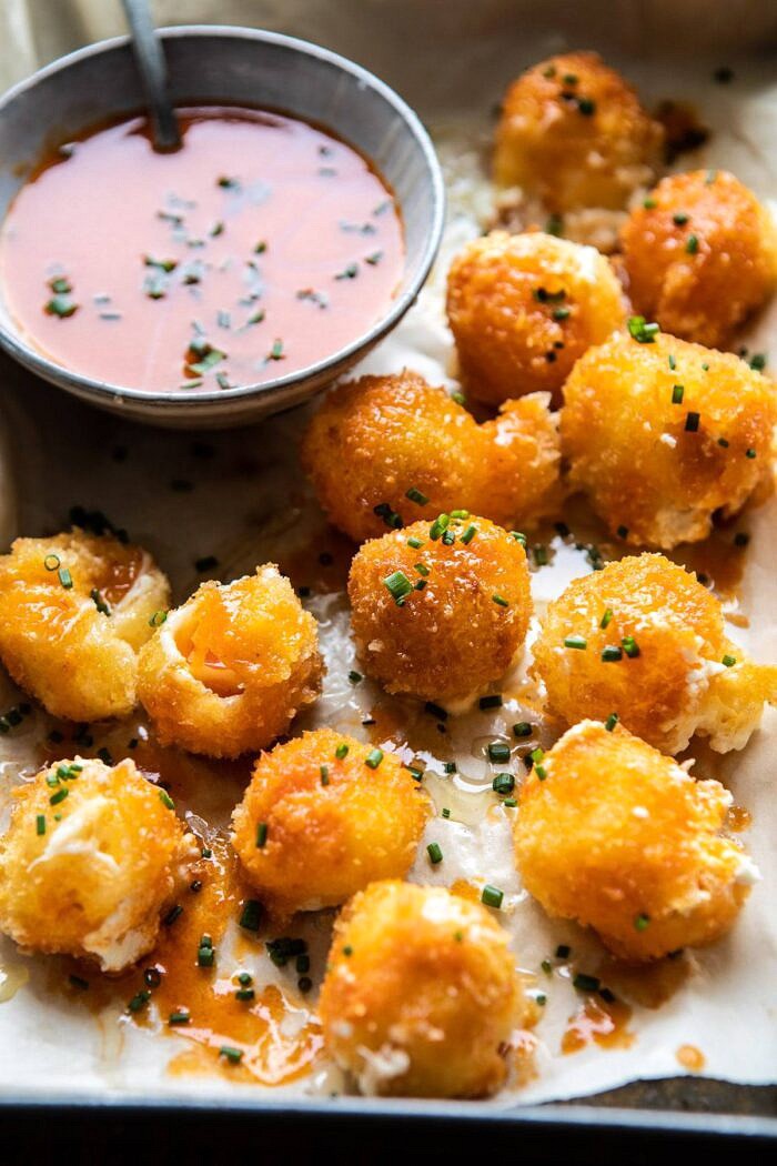 Fried Buffalo Goat Cheese Balls | halfbakedharvest.com #goatcheese #appetizers #superbowl #snacks side angled photo of Fried Buffalo Goat Cheese Balls