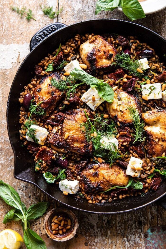 One Skillet Greek Sun-Dried Tomato Chicken and Farro | halfbakedharvest.com #skilletrecipes #chicken #healthyrecipes #onepan #easyrecipes overhead close up photo of One Skillet Greek Sun-Dried Tomato Chicken and Farro