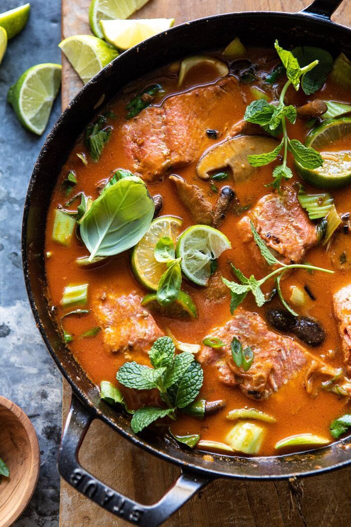 Saucy 30 Minute Thai Basil Salmon Curry | halfbakedharvest.com #healthyrecipes #salmon #curry #winterrecipes #thairecipes overhead photo of Saucy 30 Minute Thai Basil Salmon Curry in skillet