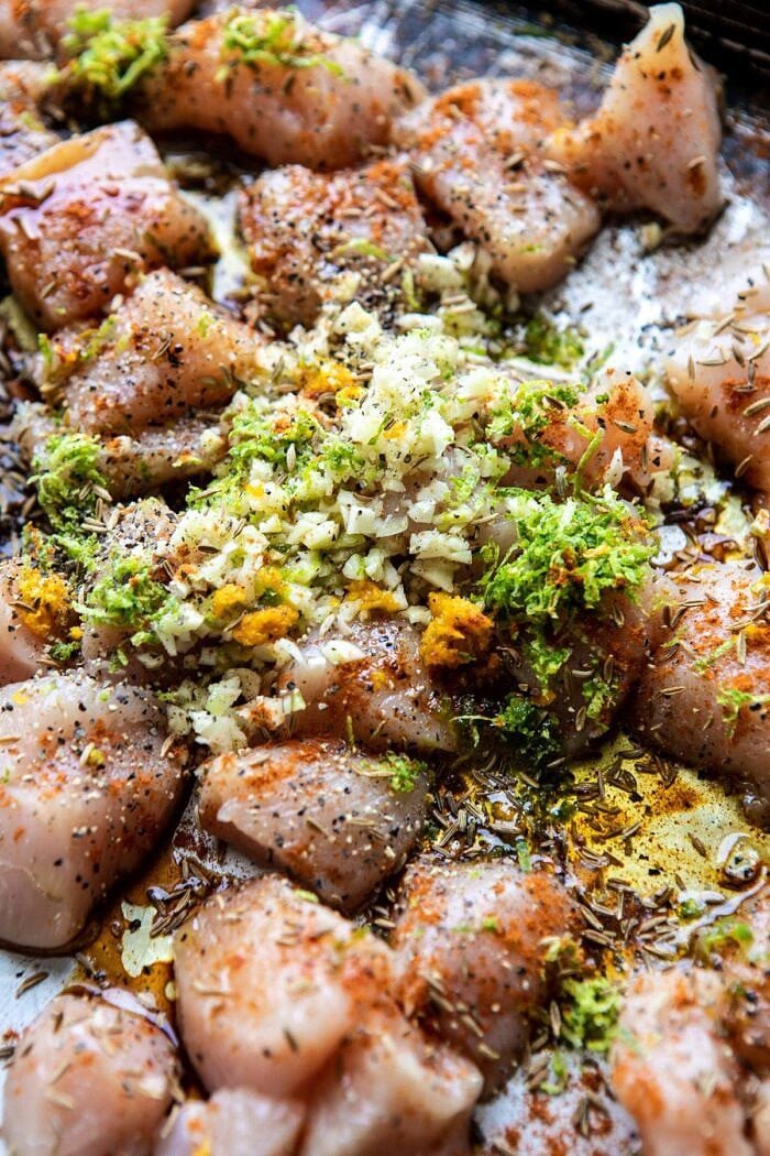 Sheet Pan Cuban Chicken and Black Bean Rice Bowl | halfbakedharvest.com #sheetpan #healthy #chicken #bowlrecipes #quick #easy raw chicken before baking