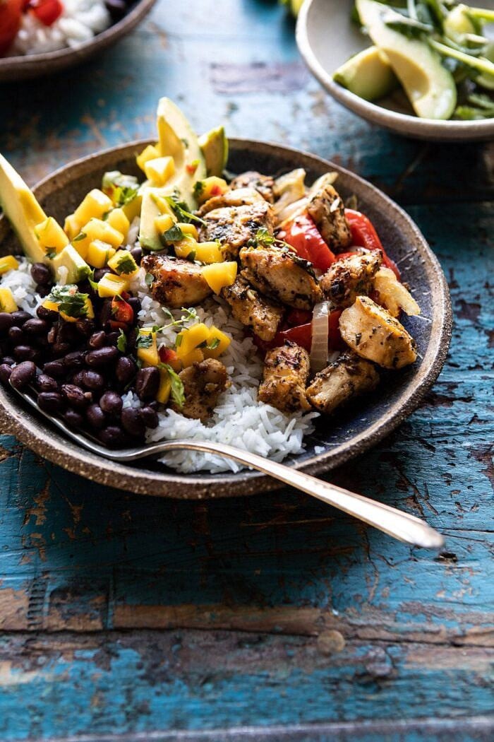 Sheet Pan Cuban Chicken and Black Bean Rice Bowl | halfbakedharvest.com #sheetpan #healthy #chicken #bowlrecipes #quick #easy side angled photo of Sheet Pan Cuban Chicken and Black Bean Rice Bowl