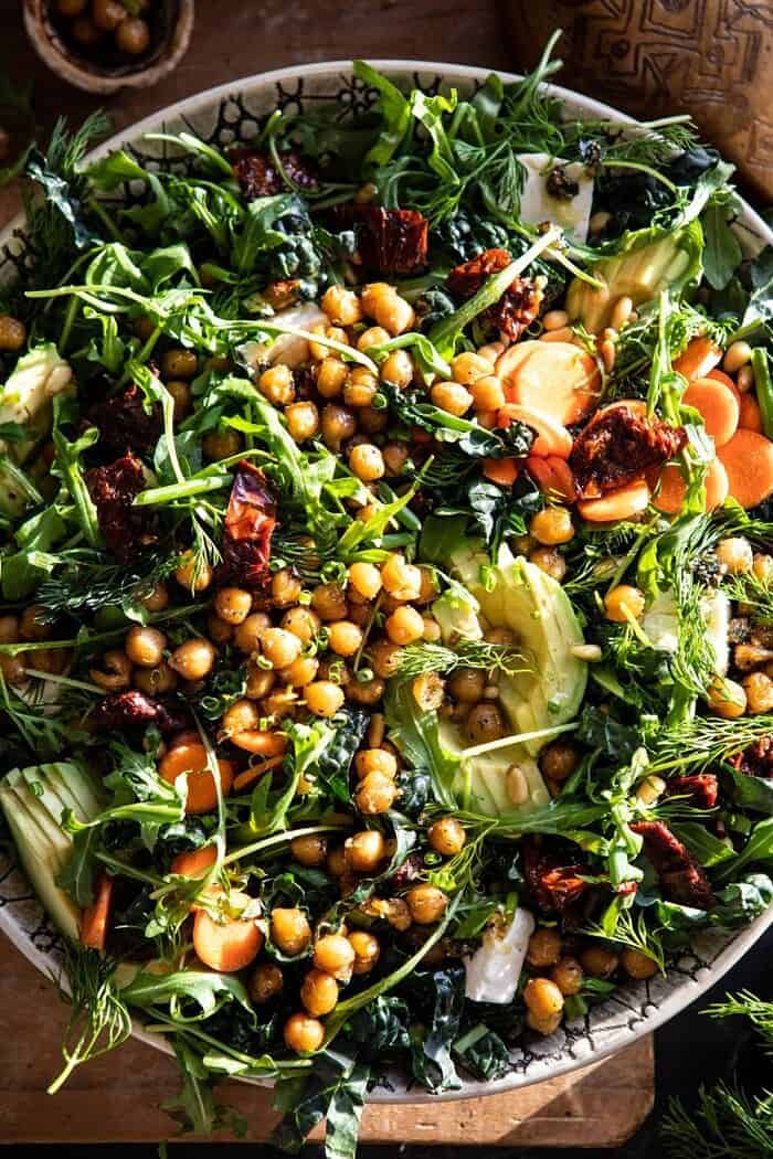 Super Green Sun-Dried Tomato Herb Salad with Crispy Chickpeas | halfbakedharvest.com #healthyrecipes #salad #easyrecipes #chickpeas #feta overhead close up photo of Super Green Sun-Dried Tomato Herb Salad with Crispy Chickpeas