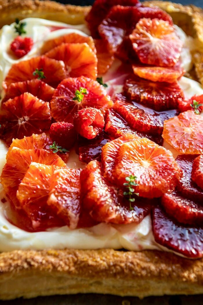 The Simplest Ombrè Citrus Cream Tart | halfbakedharvest.com #dessert #winter #citrus #healthyrecipes #easyrecipes side angle close up photo of Ombrè Citrus Cream Tart