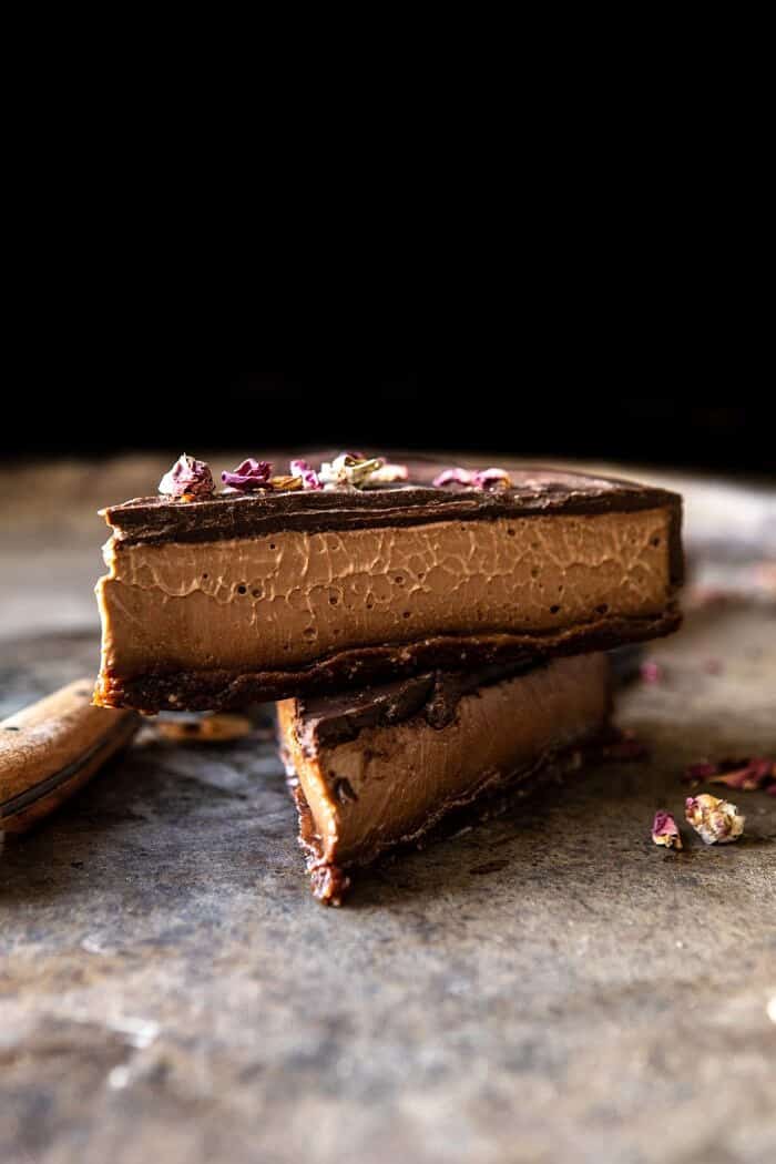 Vegan Triple Chocolate Mousse Cake | halfbakedharvest.com #chocolate #vegan #easyrecipes #dessert #cake #healthyrecipes side angle photo of Vegan Triple Chocolate Mousse Cake 2 pieces stack on top of each other