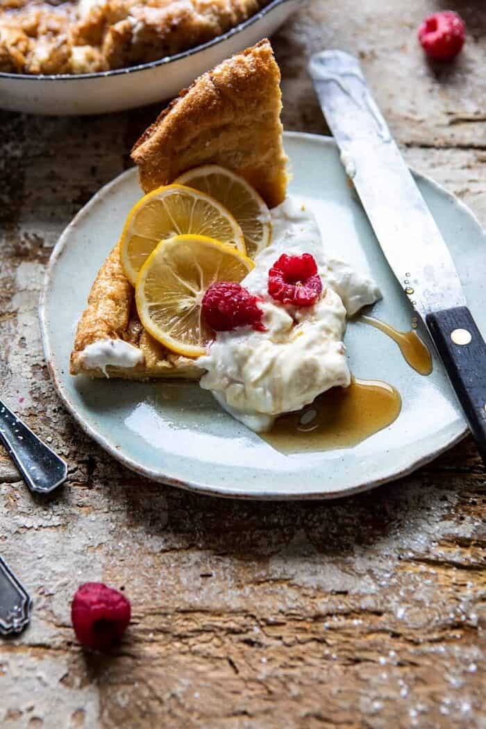 cut piece of Whole Wheat Dutch Baby with Meyer Lemon Whipped Ricotta on plate