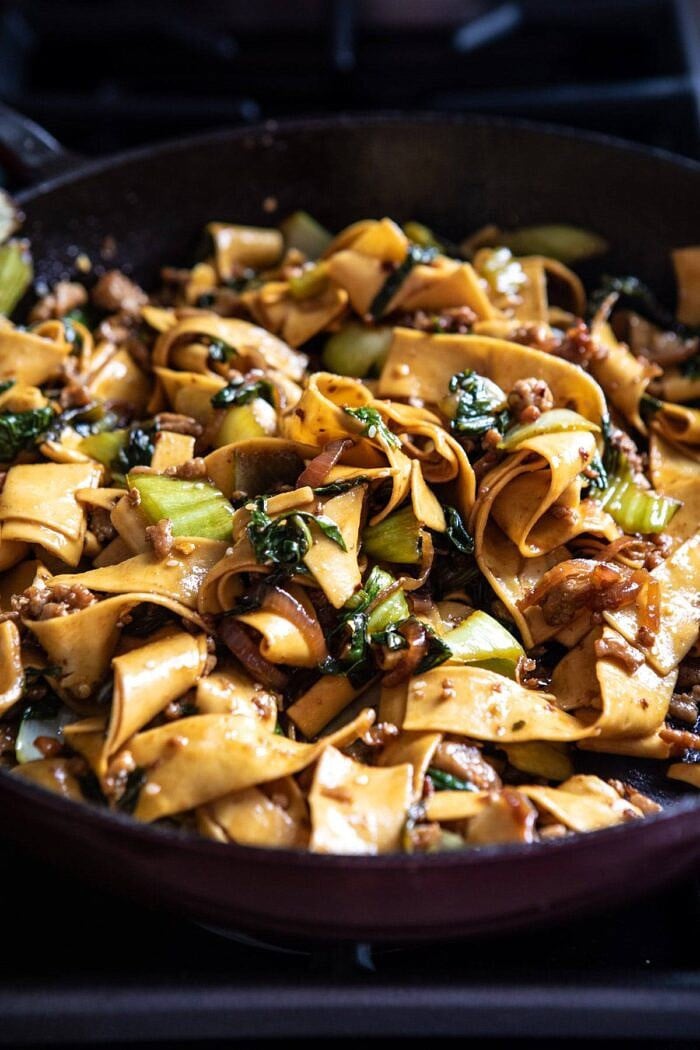 Better Than Takeout Szechuan Noodles with Sesame Chili Oil | halfbakedharvest.com #easyrecipes #chinesenoodles #asian Better Than Takeout Szechuan Noodles in skillet