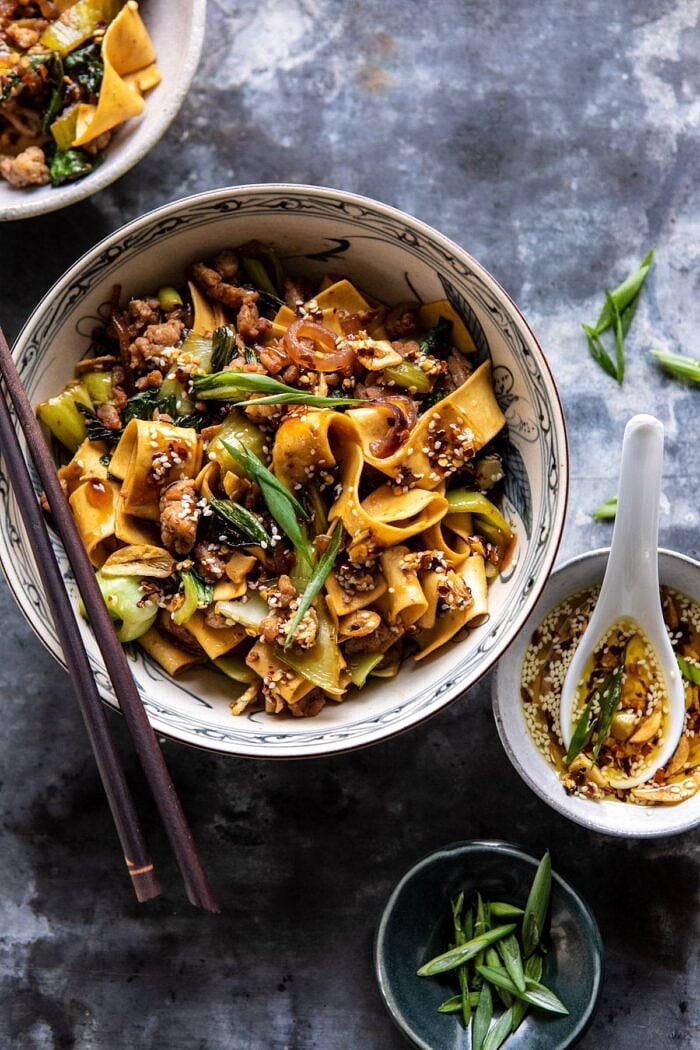 Better Than Takeout Szechuan Noodles with Sesame Chili Oil | halfbakedharvest.com #dinner #noodles #easyrecipes #chinese overhead close up photo of Better Than Takeout Szechuan Noodles with Sesame Chili Oil
