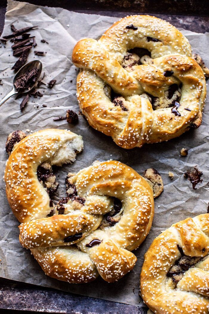 Chocolate Chip Cookie Stuffed Soft Pretzels | halfbakedharvest.com #pretzels #cookies #chocolatechipcookies #dessert #superbowl Chocolate Chip Cookie Stuffed Soft Pretzels broken apart