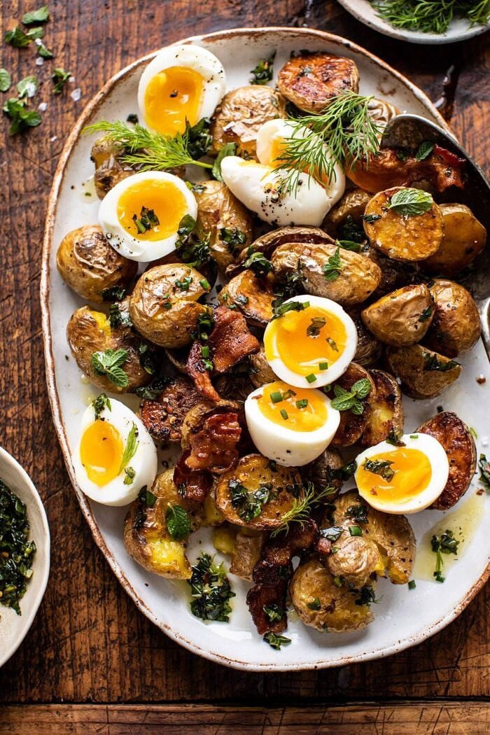 overhead close up photo of Crispy Breakfast Potatoes with Chili Garlic Oil and Herbs 