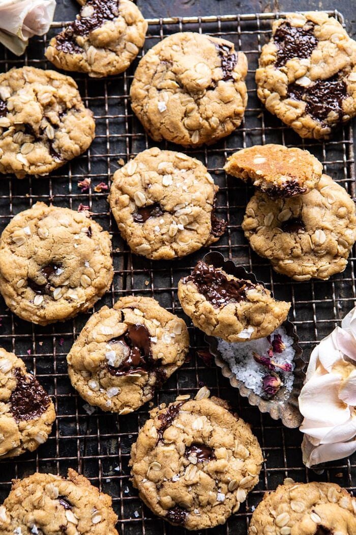 close up overhead photo of Peanut Butter Chocolate Chunk Oatmeal Cookies broken in half