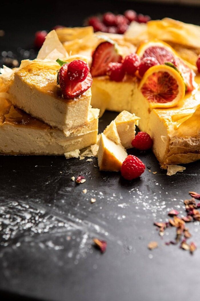 Whipped Lemon Ricotta Cheesecake | halfbakedharvest.com #cheesecake #easyrecipe #ricotta #deesert #cake #valentinesday Whipped Lemon Ricotta Cheesecake with 2 slices stacked one on top of the other