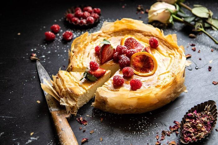 Whipped Lemon Ricotta Cheesecake | halfbakedharvest.com #cheesecake #easyrecipe #ricotta #deesert #cake #valentinesday horizontal photo of Whipped Lemon Ricotta Cheesecake