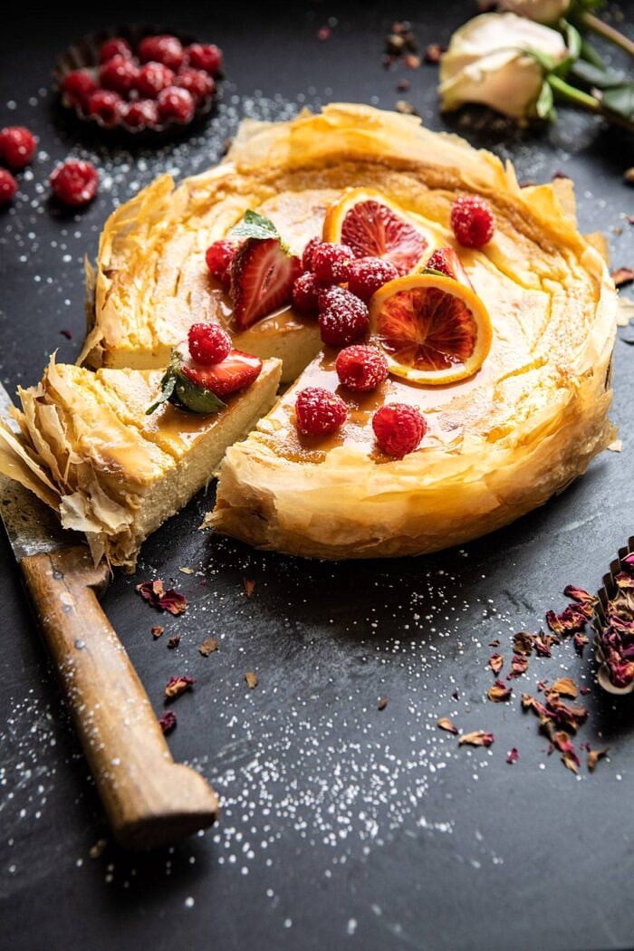 Whipped Lemon Ricotta Cheesecake | halfbakedharvest.com #cheesecake #easyrecipe #ricotta #deesert #cake #valentinesday Whipped Lemon Ricotta Cheesecake with 1 slice cut