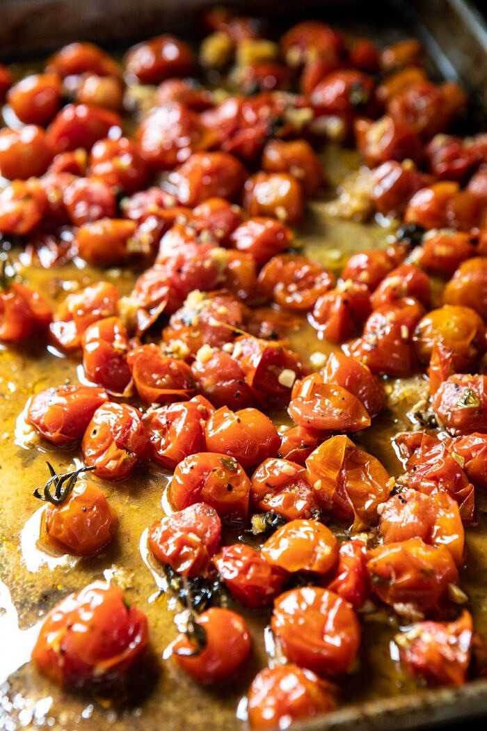 Caprese Pesto Pasta Bake | halfbakedharvest.com #caprese #pesto #pasta #easyrecipes roasted tomatoes on baking sheet