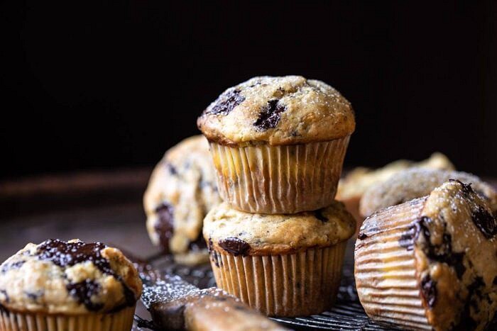 Cheesecake Stuffed Chocolate Chunk Banana Bread Muffins | halfbakedharvest.com #muffins #cheesecake #bananamuffin #dessert horizontal photo of Cheesecake Stuffed Chocolate Chunk Banana Bread Muffins